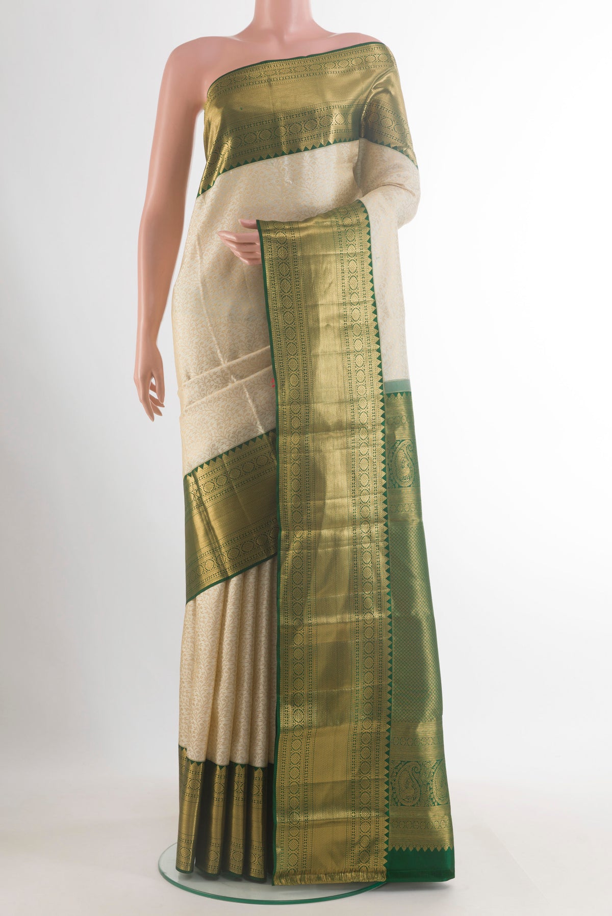 Pure Silk Off White Kanjivaram Saree with Zari Brocade on the body and Zari Border.  displayed on a mannequin