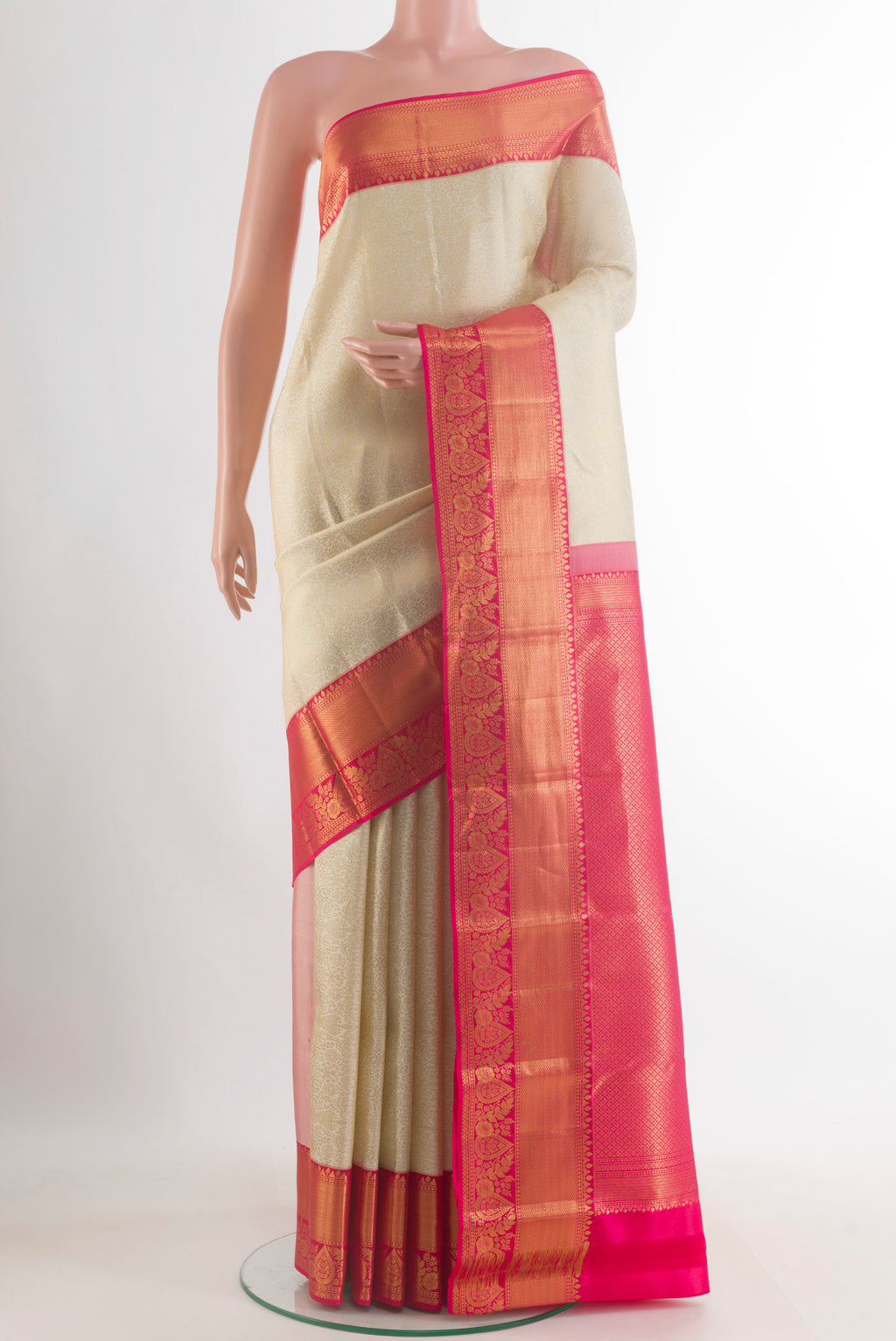 Pure Silk Off White Kanjivaram Saree with Zari Brocade on the body and Zari Border.  displayed on a mannequin