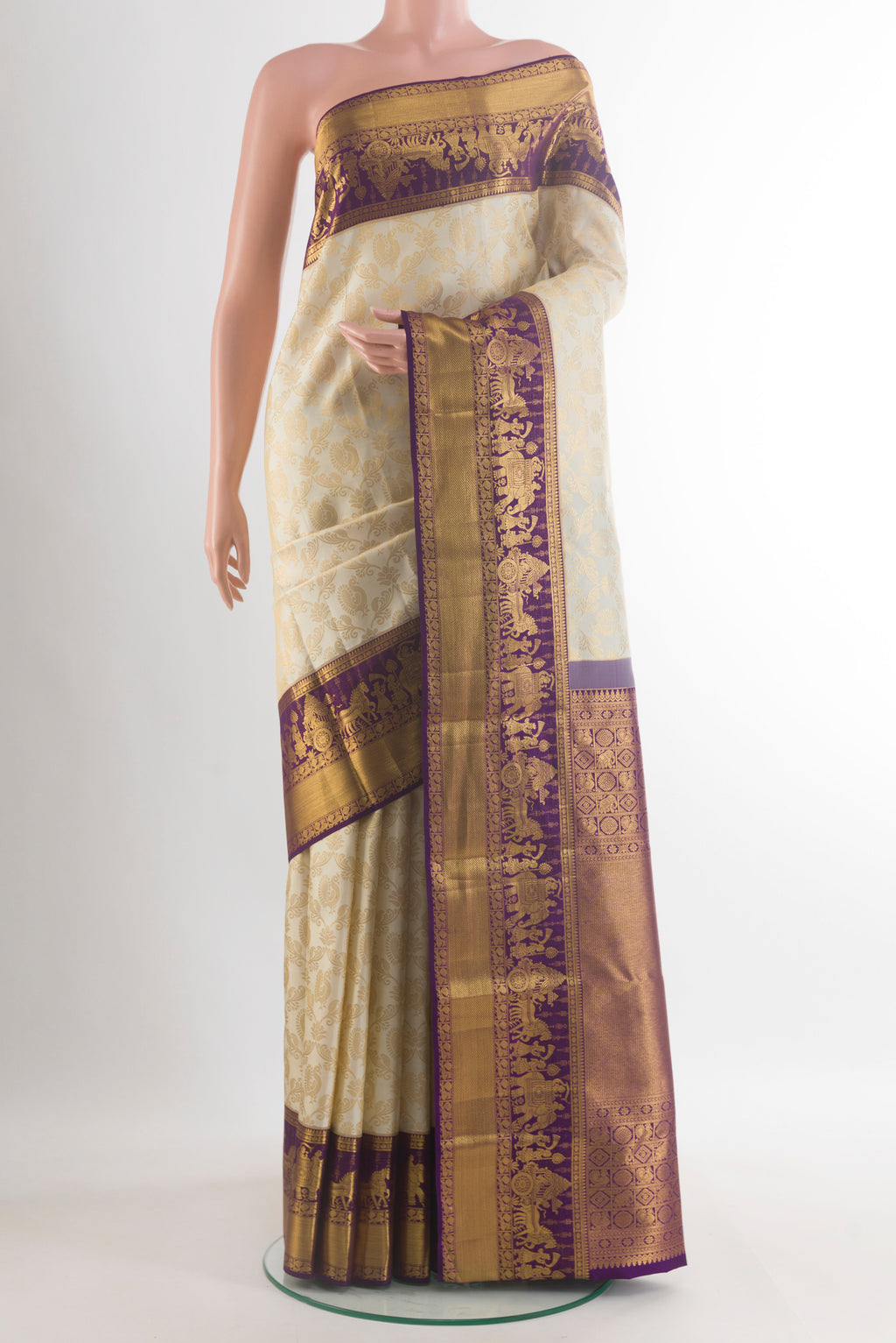 Pure Silk Off White Kanjivaram Saree with Zari Brocade on the body and Zari Border.  displayed on a mannequin