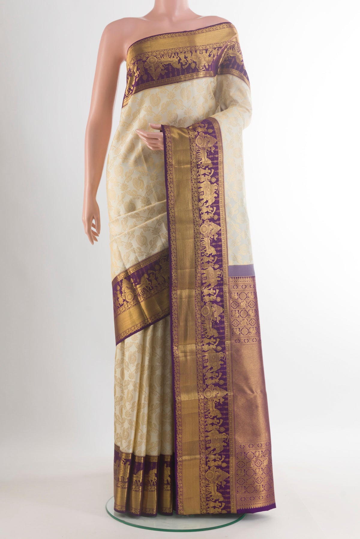 Pure Silk Off White Kanjivaram Saree with Zari Brocade on the body and Zari Border.  displayed on a mannequin