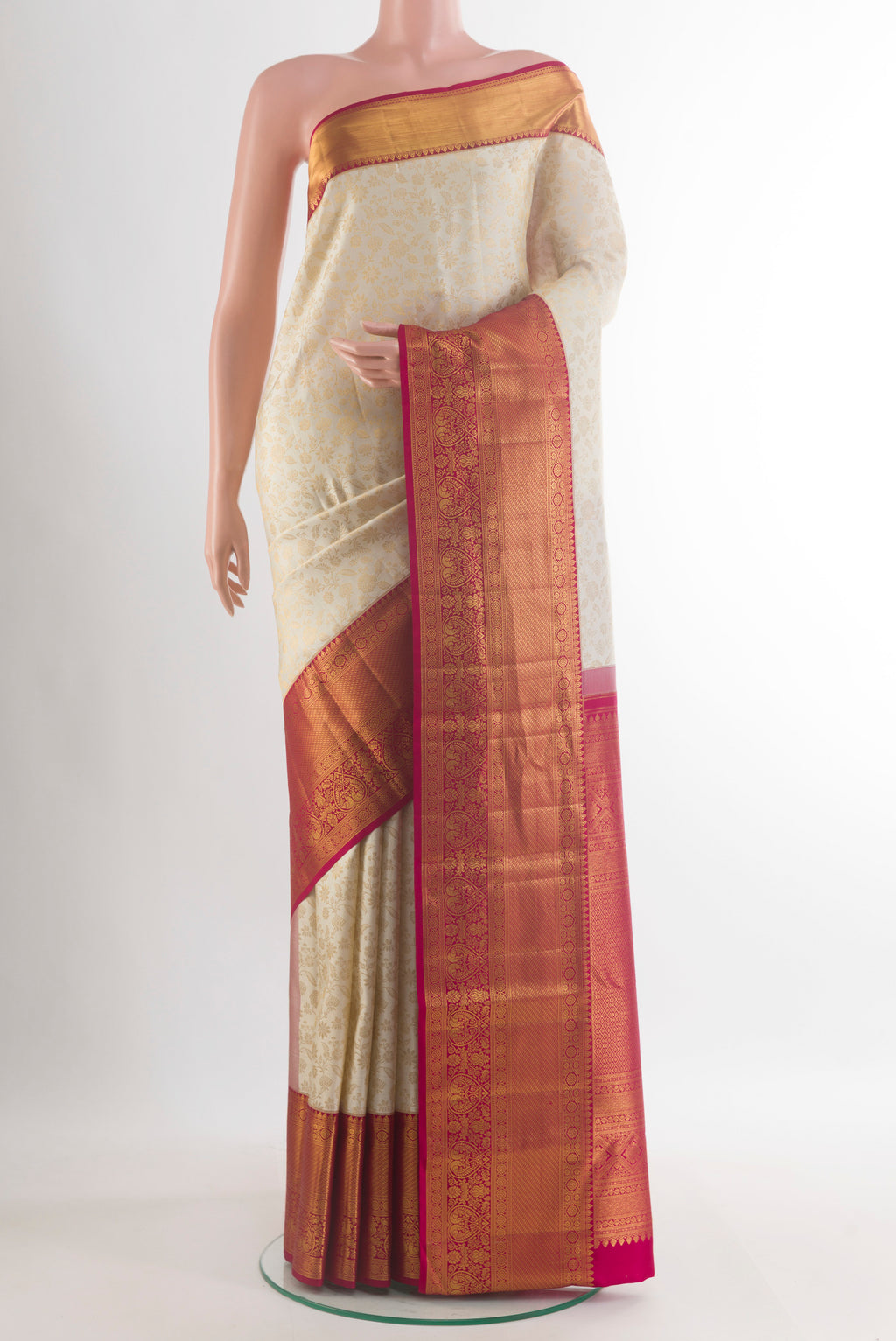 Pure Silk Off White Kanjivaram Saree with Zari Brocade on the body and Zari Border.  displayed on a mannequin