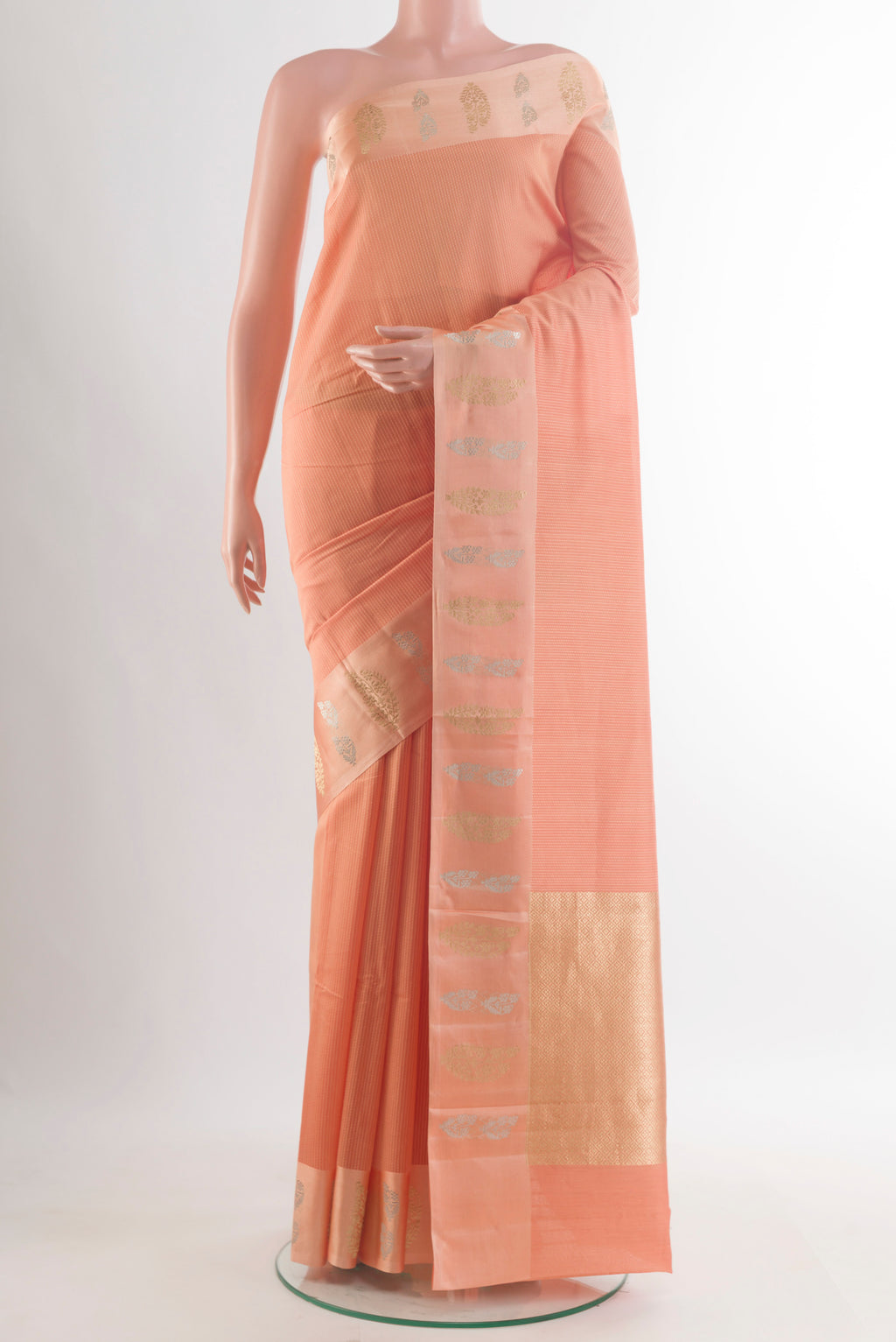 Pure Silk Peach Banarasi Katan Saree with Stripes on the body and Zari Border.  displayed on a mannequin