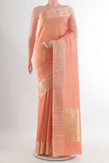 Pure Silk Peach Banarasi Katan Saree with Stripes on the body and Zari Border.  displayed on a mannequin