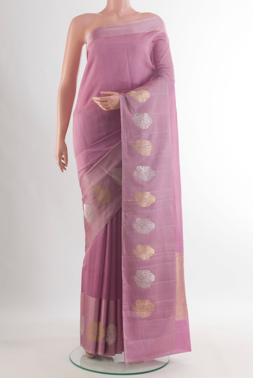 Pure Silk Lavender Banarasi Katan Saree with Stripes on the body and Zari Border.  displayed on a mannequin