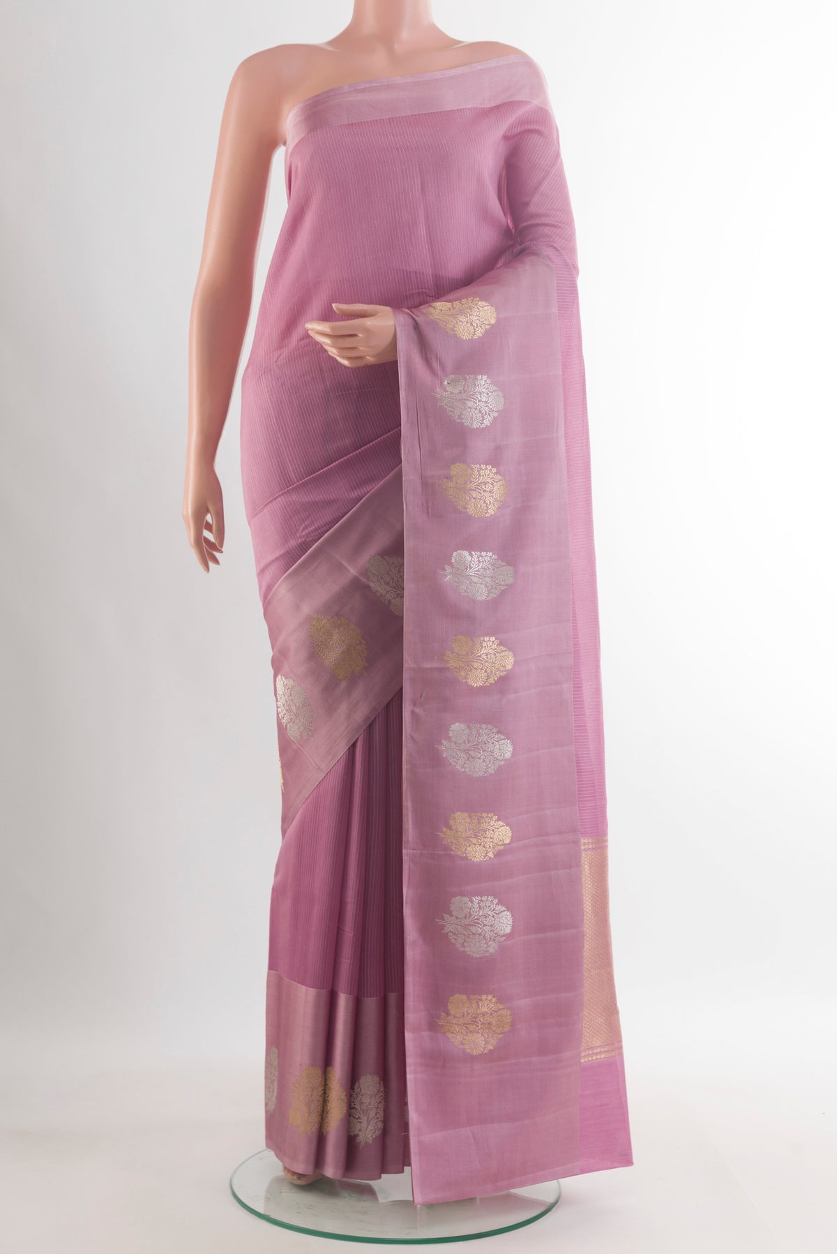 Pure Silk Lavender Banarasi Katan Saree with Stripes on the body and Zari Border.  displayed on a mannequin