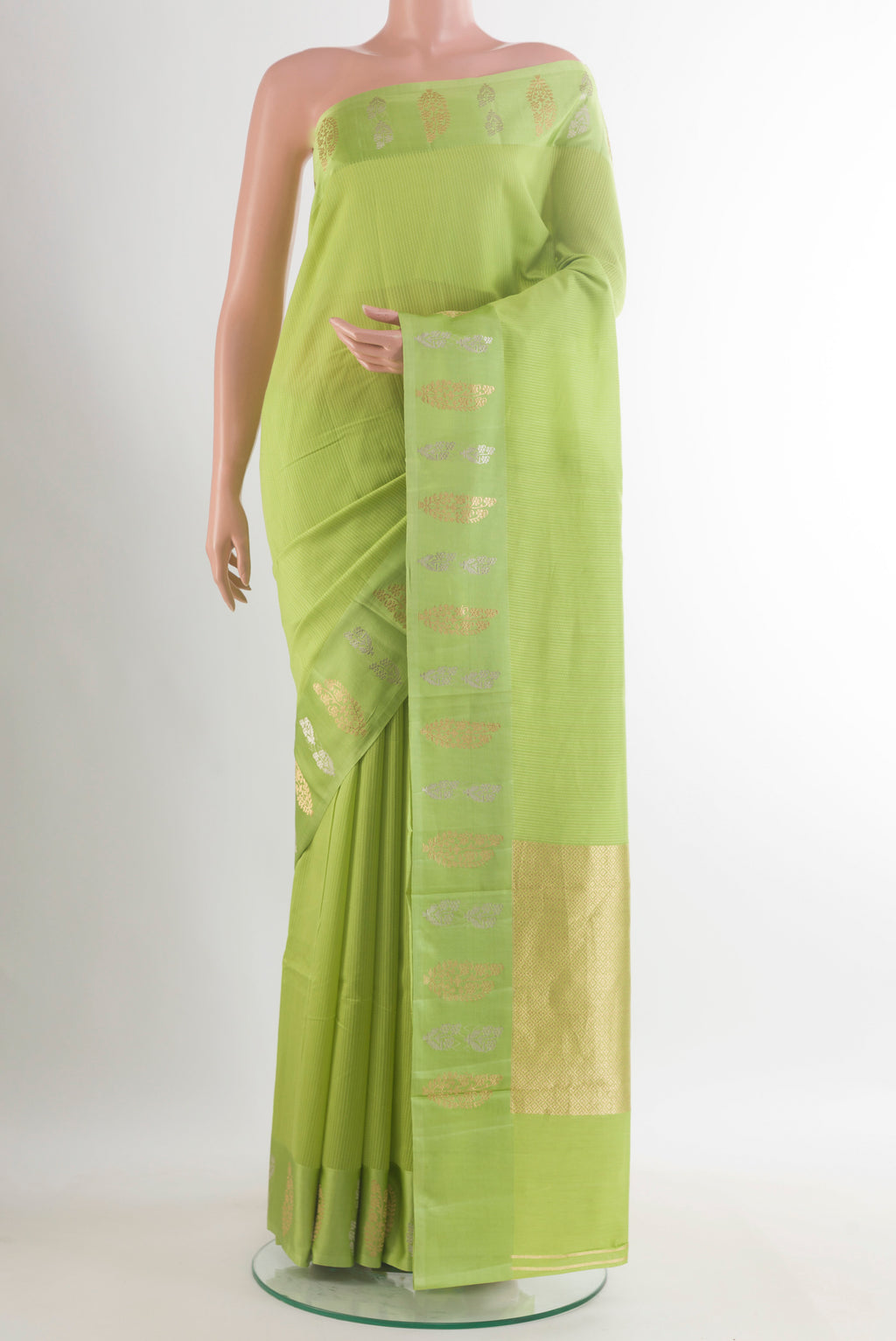 Pure Silk Green Banarasi Katan Saree with Stripes on the body and Zari Border.  displayed on a mannequin