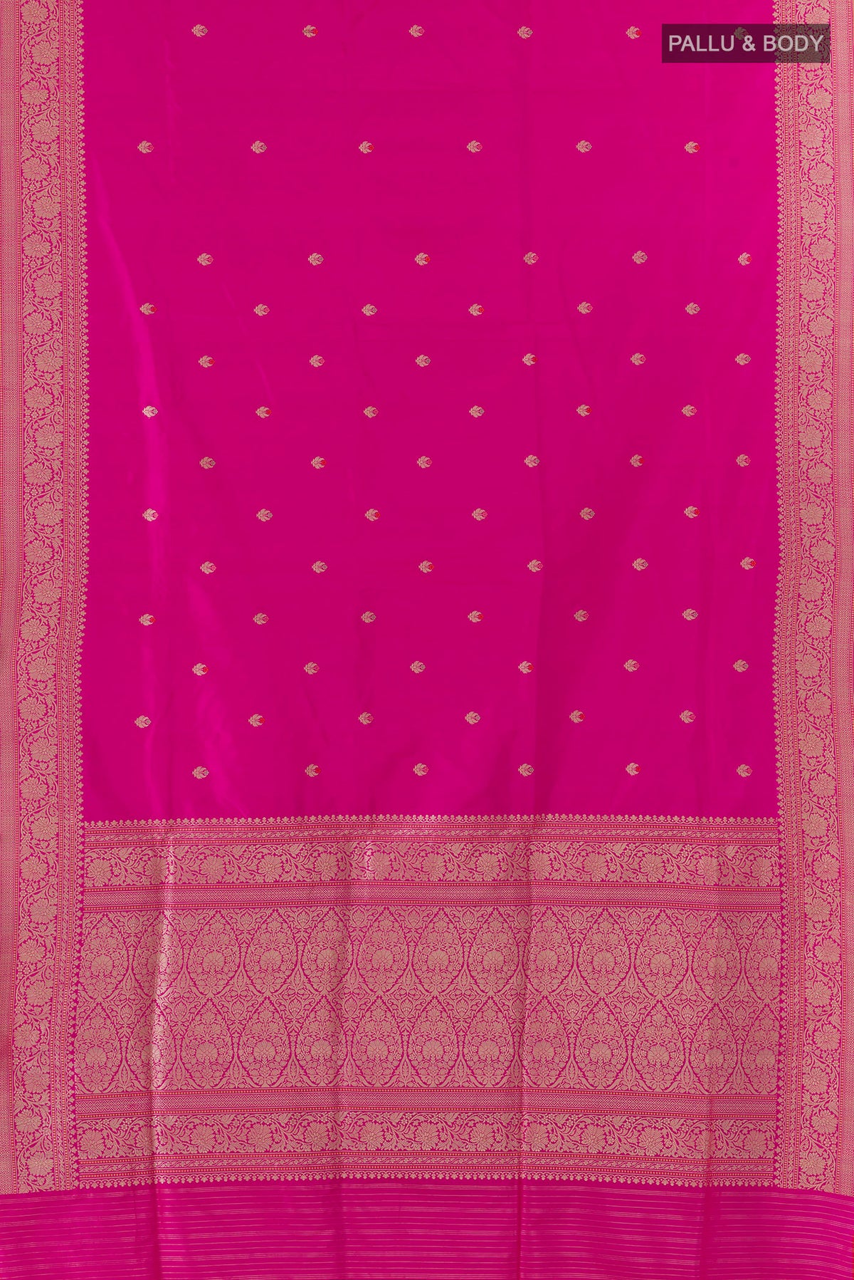 Flat view of Pure Silk Rani Pink Banarasi Saree with Zari Butta on the body and Zari Border. 