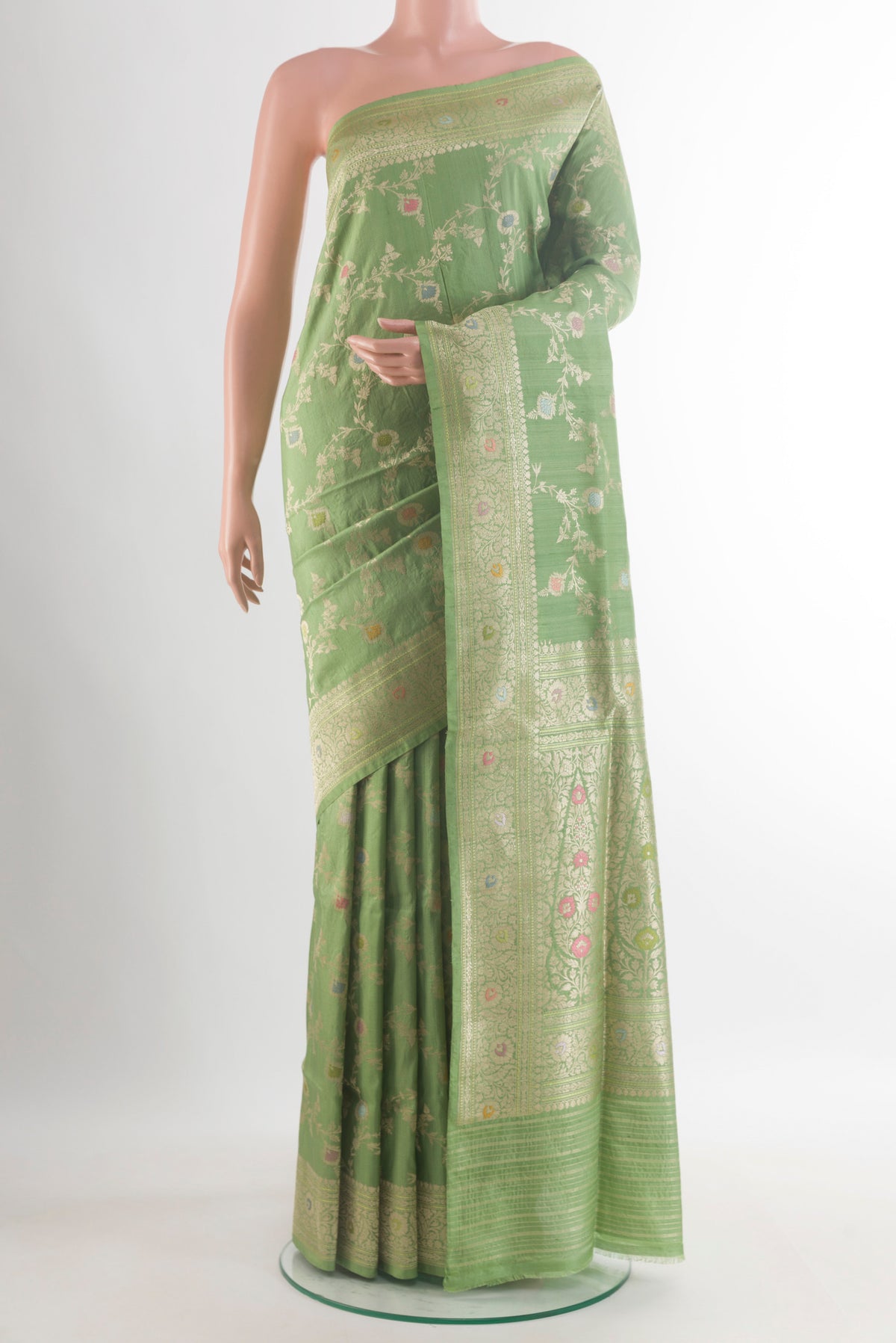 Pure Silk Green Banarasi Tussar Saree with Zari Brocade on the body and Zari Border.  displayed on a mannequin
