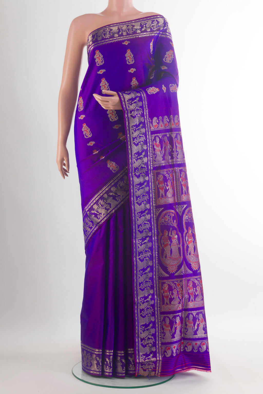 Pure Silk Purple Baluchari Saree with Zari And Thread Butta on the body and Zari Border.  displayed on a mannequin