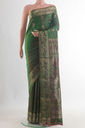 Pure Silk Green Baluchari Saree with Zari Butta on the body and Zari Border.  displayed on a mannequin