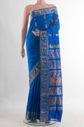 Pure Silk Royal Blue Baluchari Saree with Zari And Thread Butta on the body and Zari Border.  displayed on a mannequin