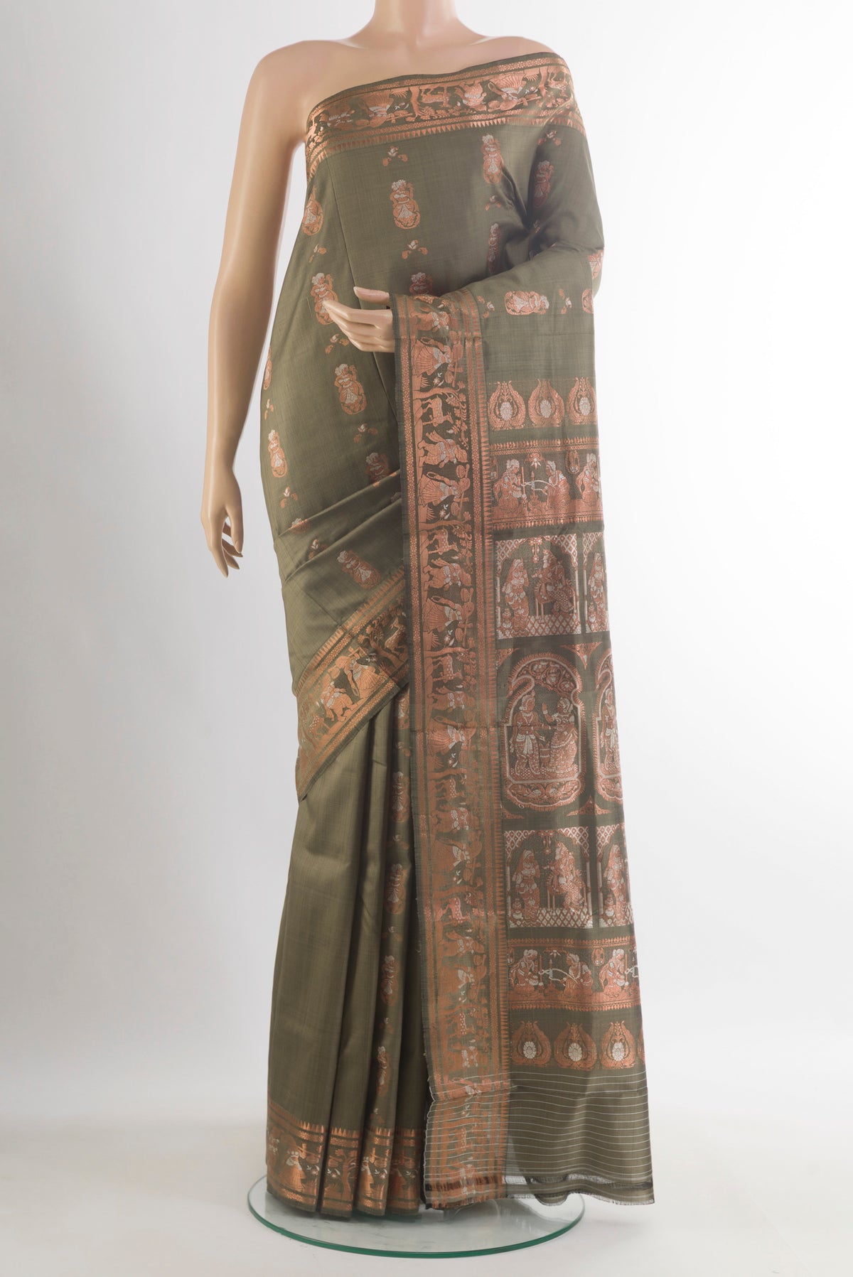Pure Silk Green Baluchari Saree with Zari And Thread Butta on the body and Zari Border.  displayed on a mannequin