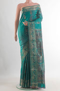 Pure Silk Green Baluchari Saree with Zari Butta on the body and Zari Border.  displayed on a mannequin