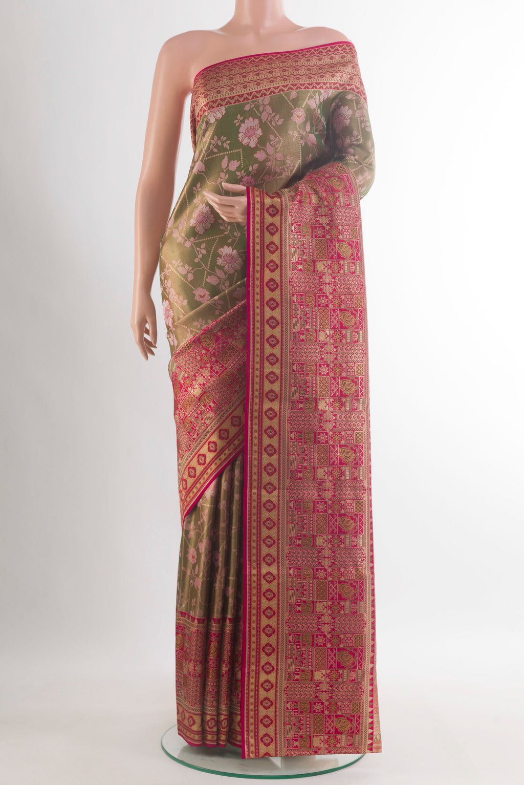 Pure Silk Mehandi Green Kanchipuram Saree with Zari Brocade on the body and Zari Border.  displayed on a mannequin