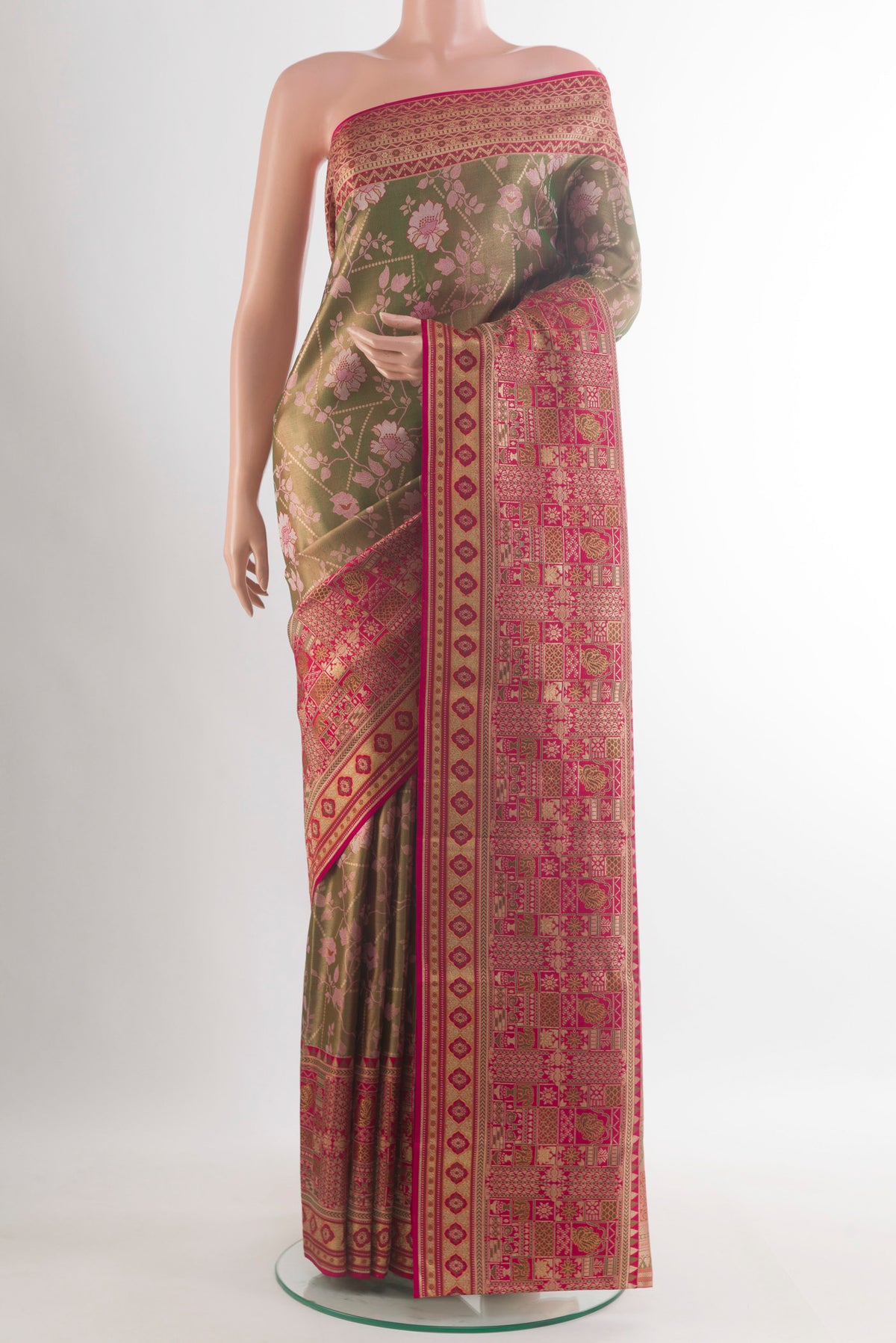 Pure Silk Mehandi Green Kanchipuram Saree with Zari Brocade on the body and Zari Border.  displayed on a mannequin