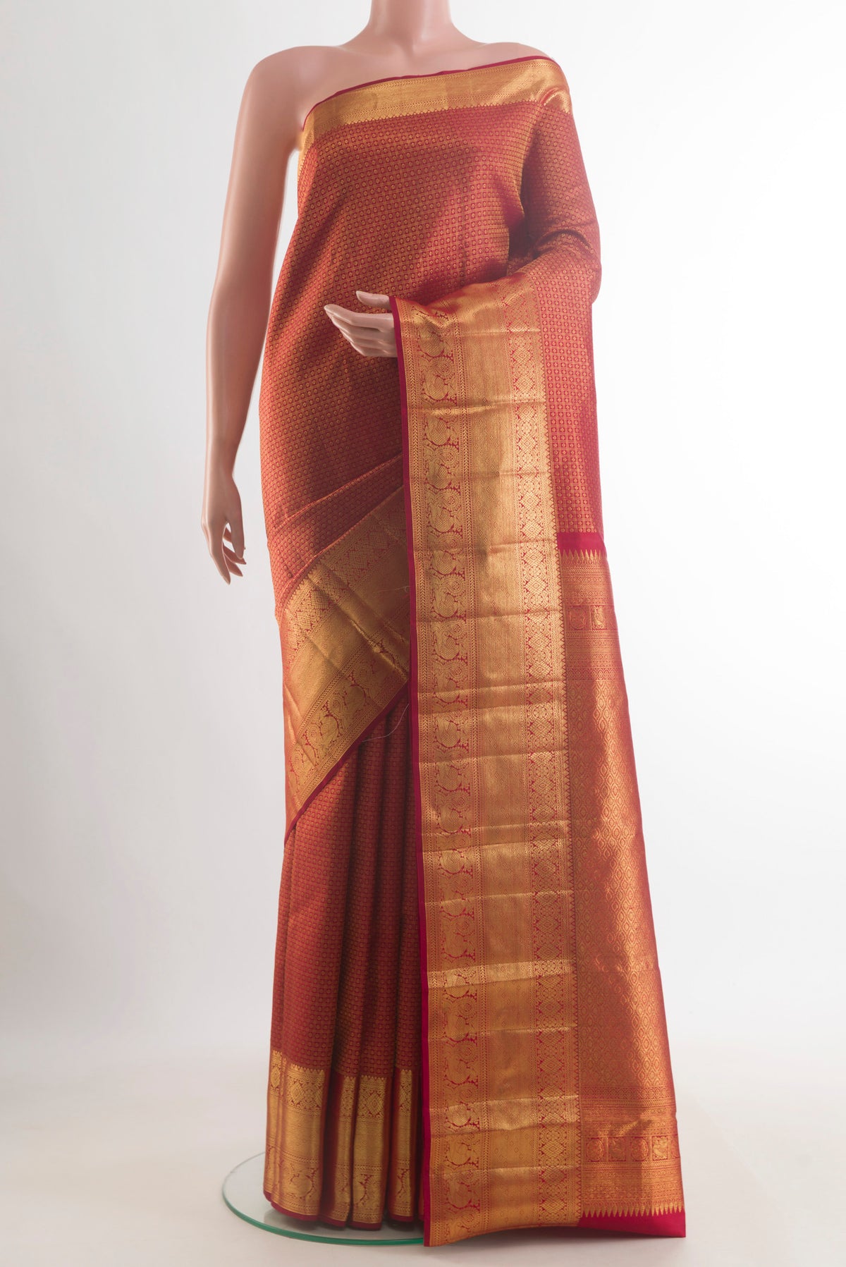 Pure Silk Red Kanchipuram Saree with Zari Brocade on the body and Zari Border.  displayed on a mannequin