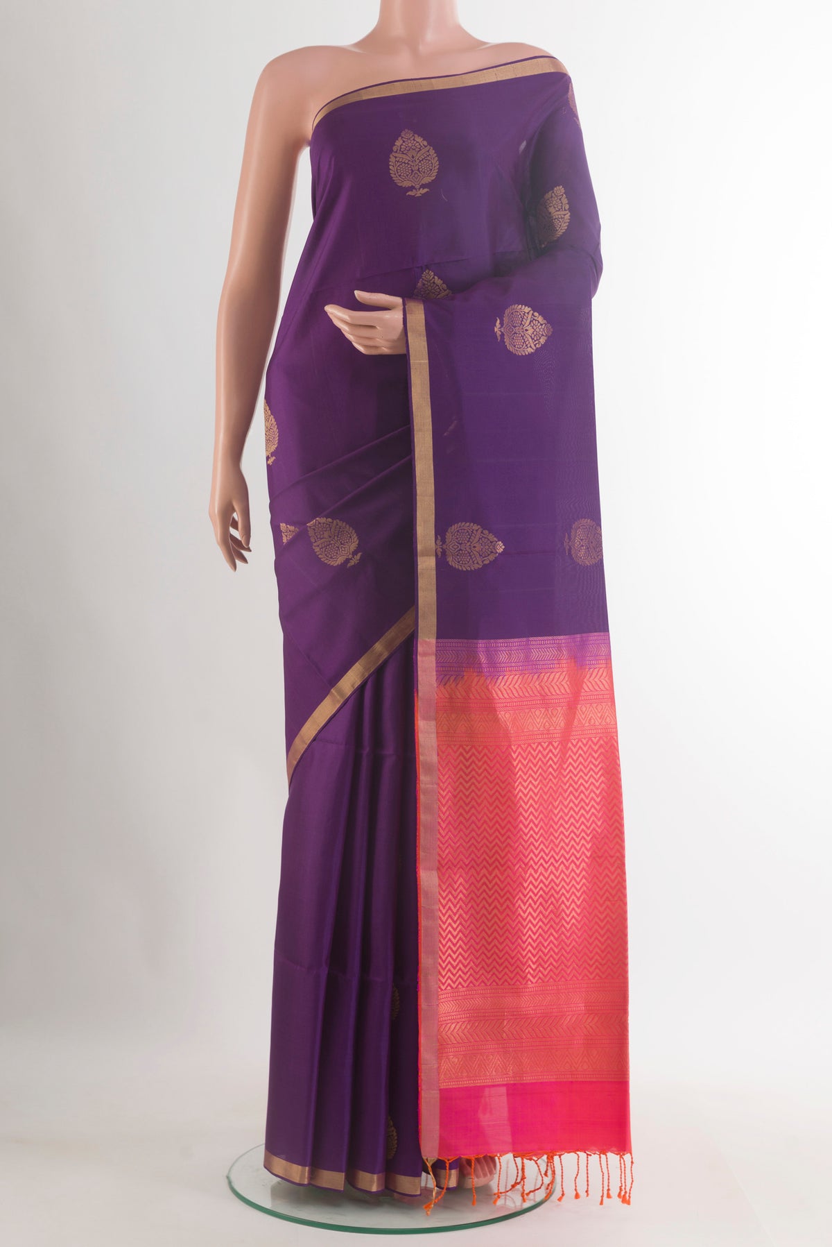 Pure Silk Purple Soft Saree with Zari Butta on the body and Zari Border.  displayed on a mannequin