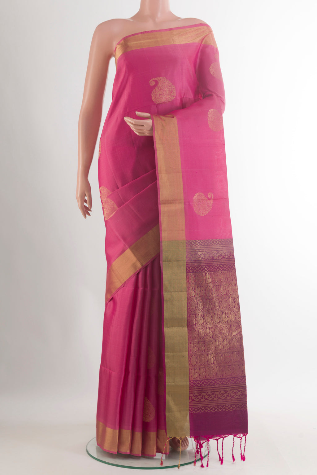 Pure Silk Pink Soft Saree with Zari Butta on the body and Zari Border.  displayed on a mannequin