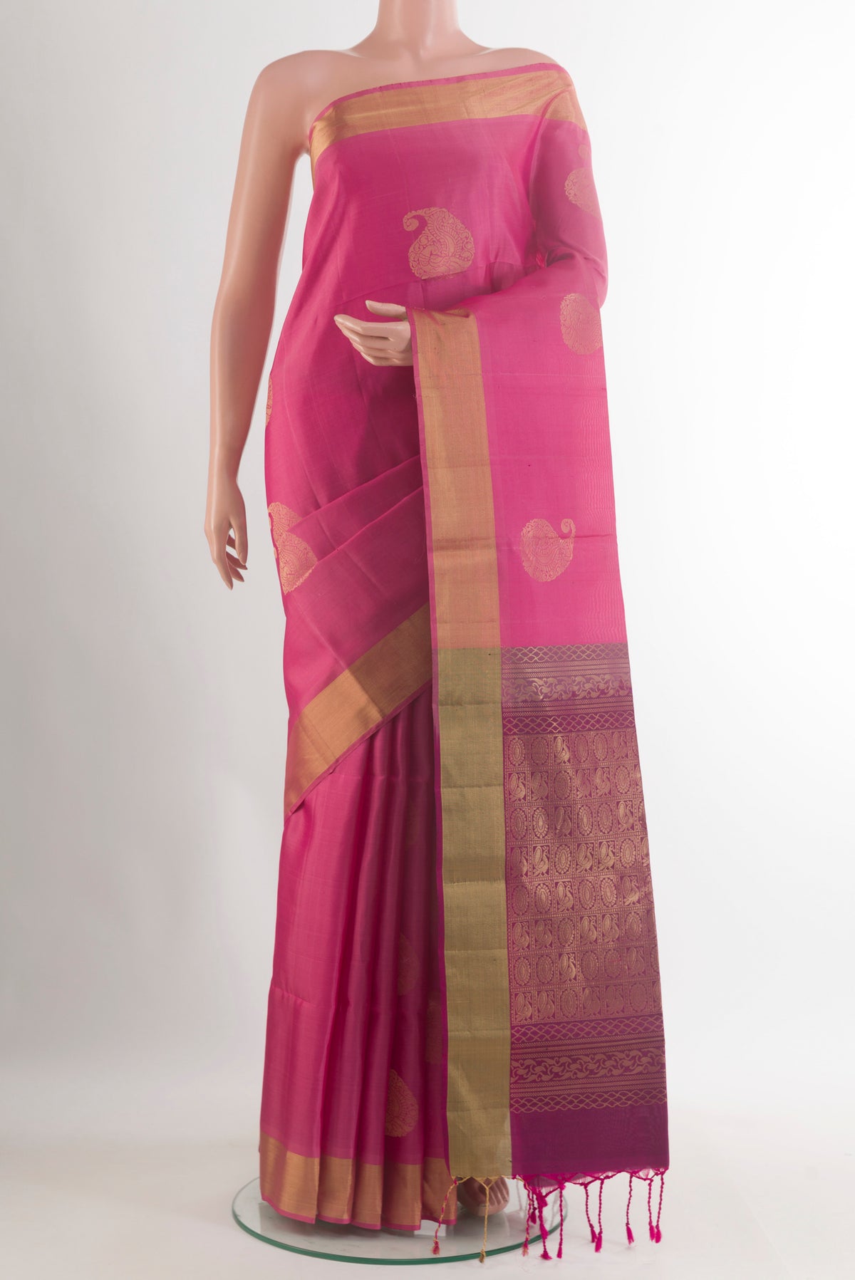 Pure Silk Pink Soft Saree with Zari Butta on the body and Zari Border.  displayed on a mannequin