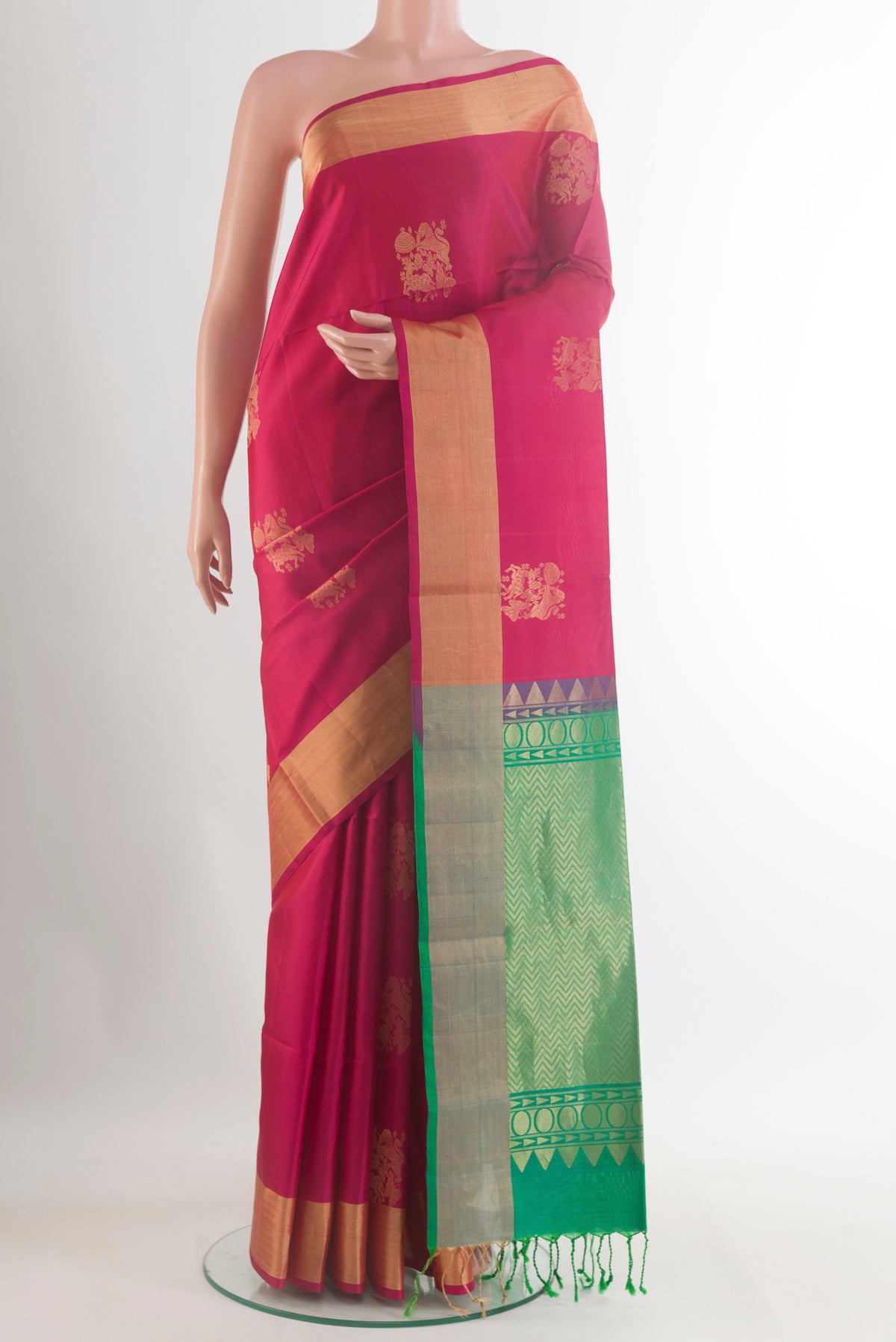 Pure Silk Pink Soft Saree with Zari Butta on the body and Zari Border.  displayed on a mannequin