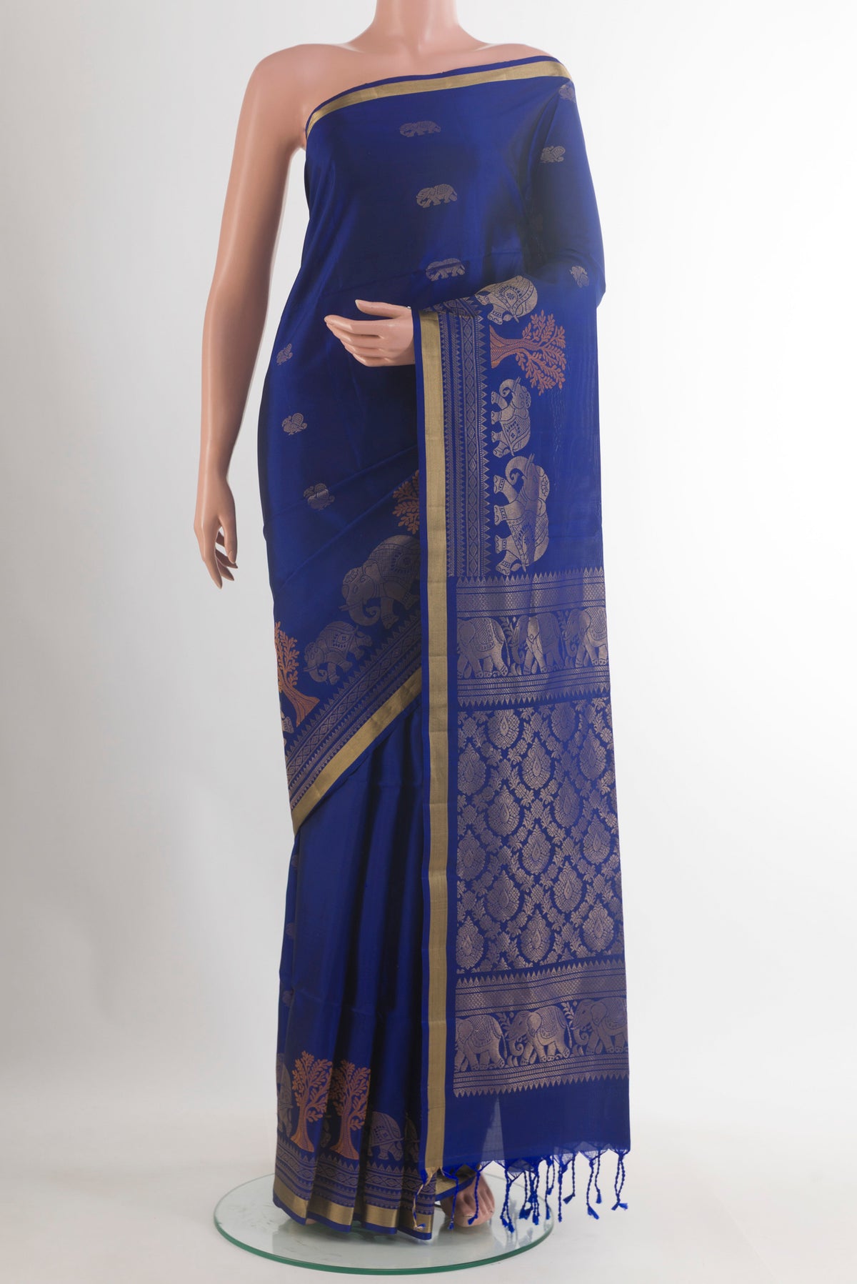 Pure Silk Blue Soft Saree with Zari Butta on the body and Zari Border.  displayed on a mannequin