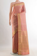 Pure Silk Peach Kanjivaram Saree with Zari Butta on the body and Zari Border.  displayed on a mannequin