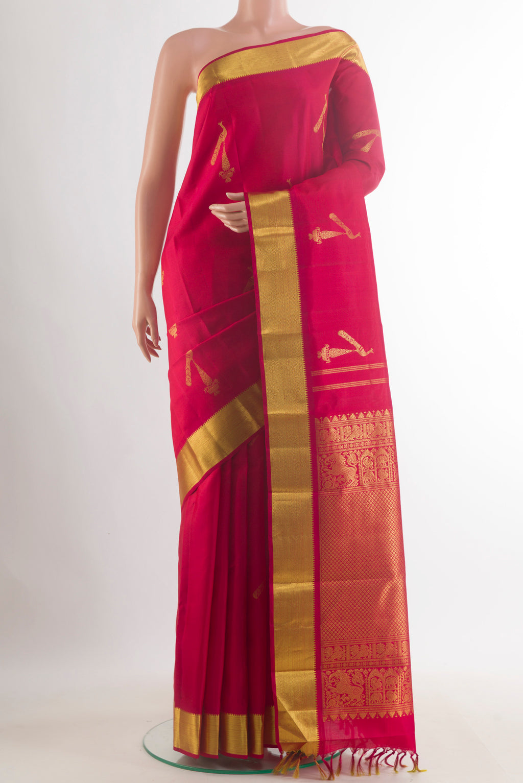 Pure Silk Red Kanjivaram Saree with Zari Butta on the body and Zari Border.  displayed on a mannequin