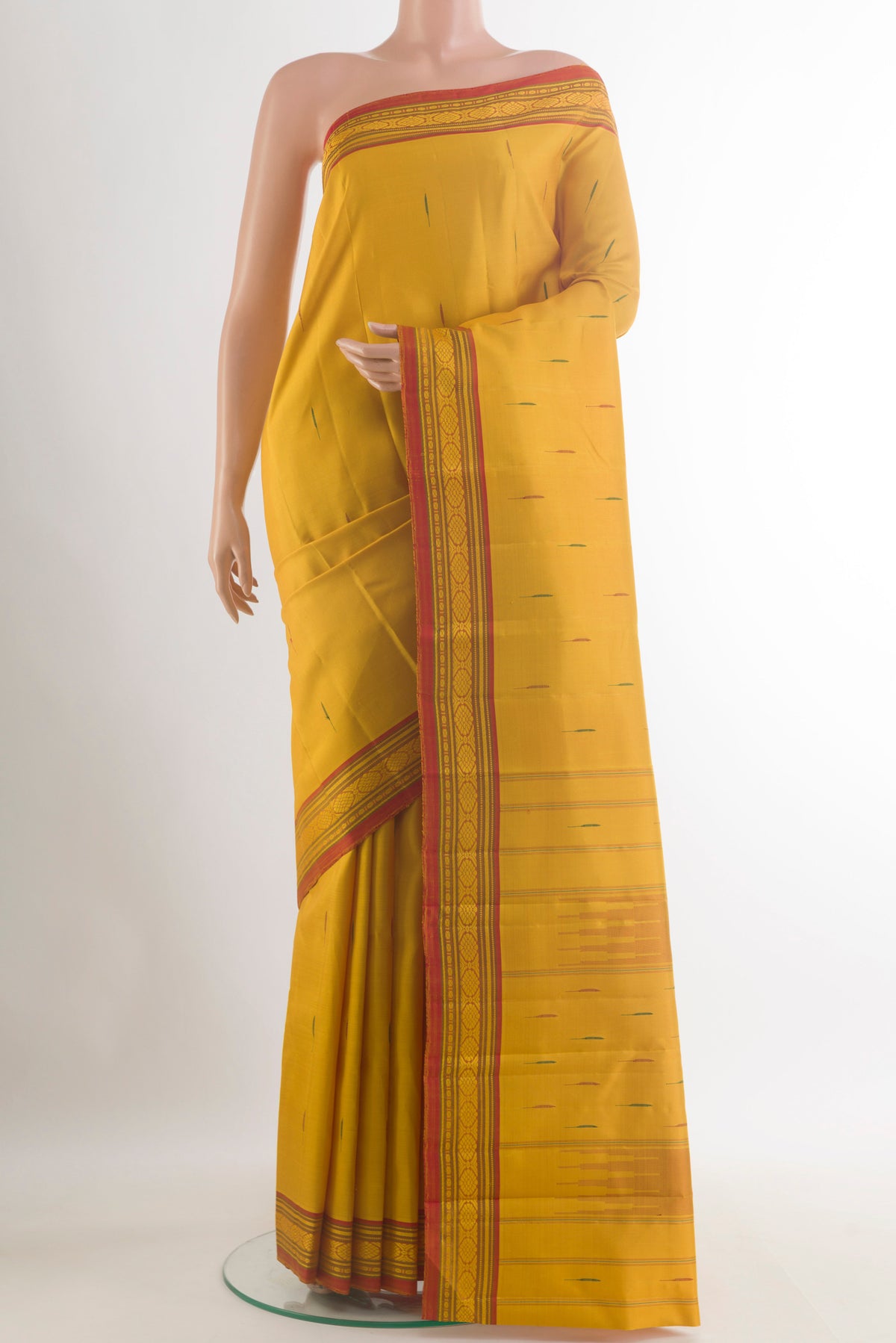Pure Silk Yellow Kanjivaram Saree with Thread Butta on the body and Thread Border.  displayed on a mannequin