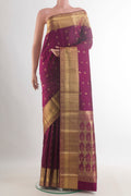 Pure Silk Maroon Kanchipuram Saree with Zari Butta on the body and Zari Border.  displayed on a mannequin
