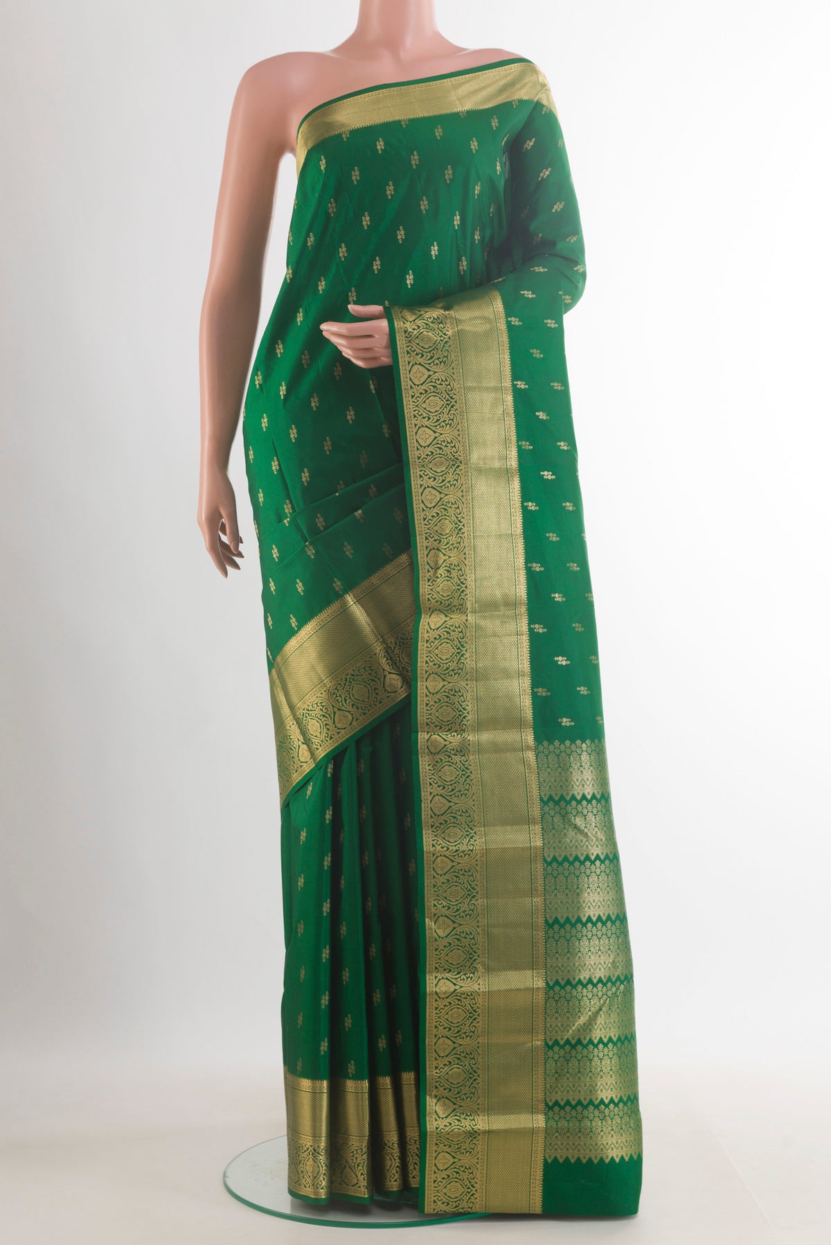 Pure Silk Green Kanchipuram Saree with Zari Butta on the body and Zari Border.  displayed on a mannequin
