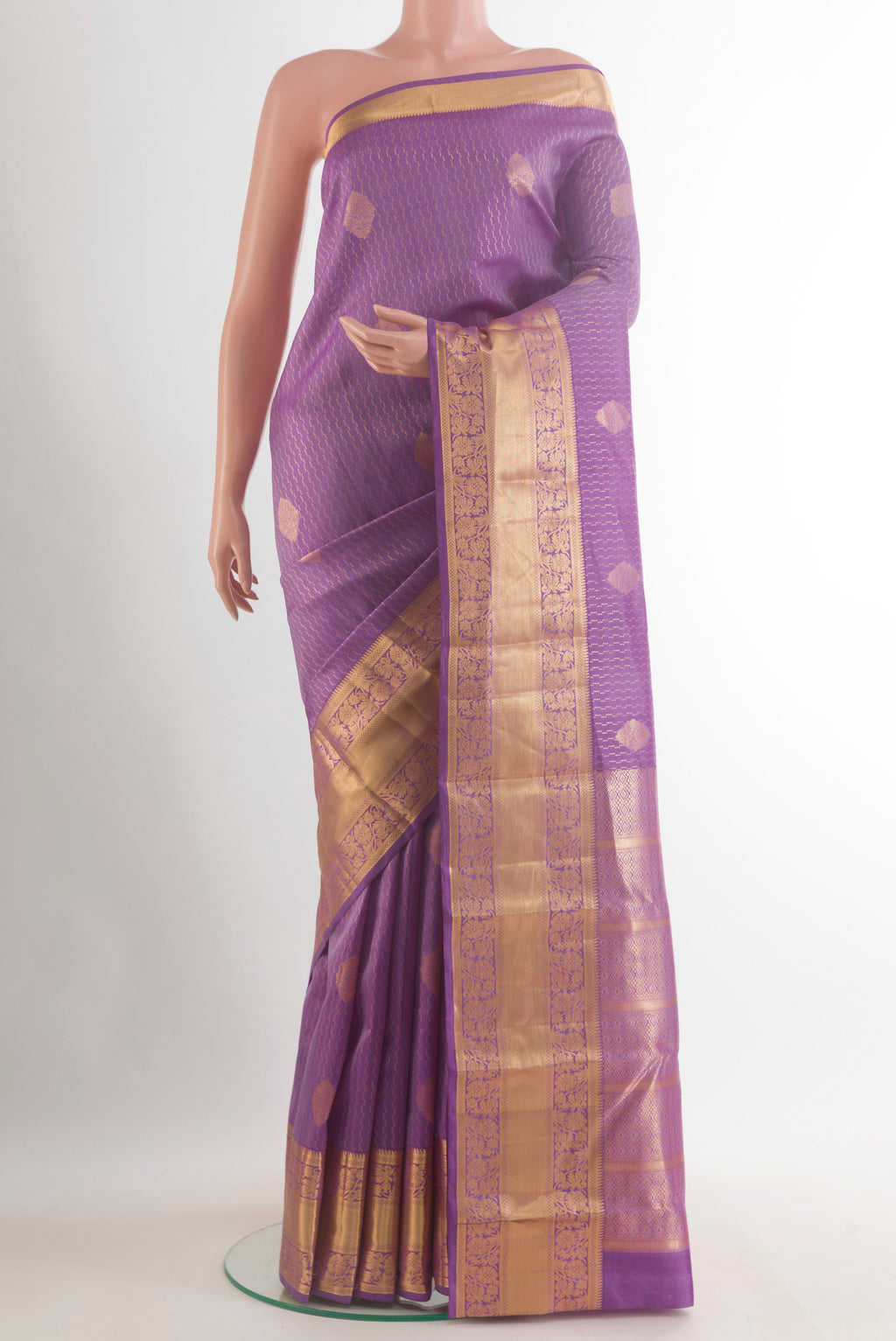 Pure Silk Lavender Kanchipuram Saree with Zari Butta on the body and Zari Border.  displayed on a mannequin