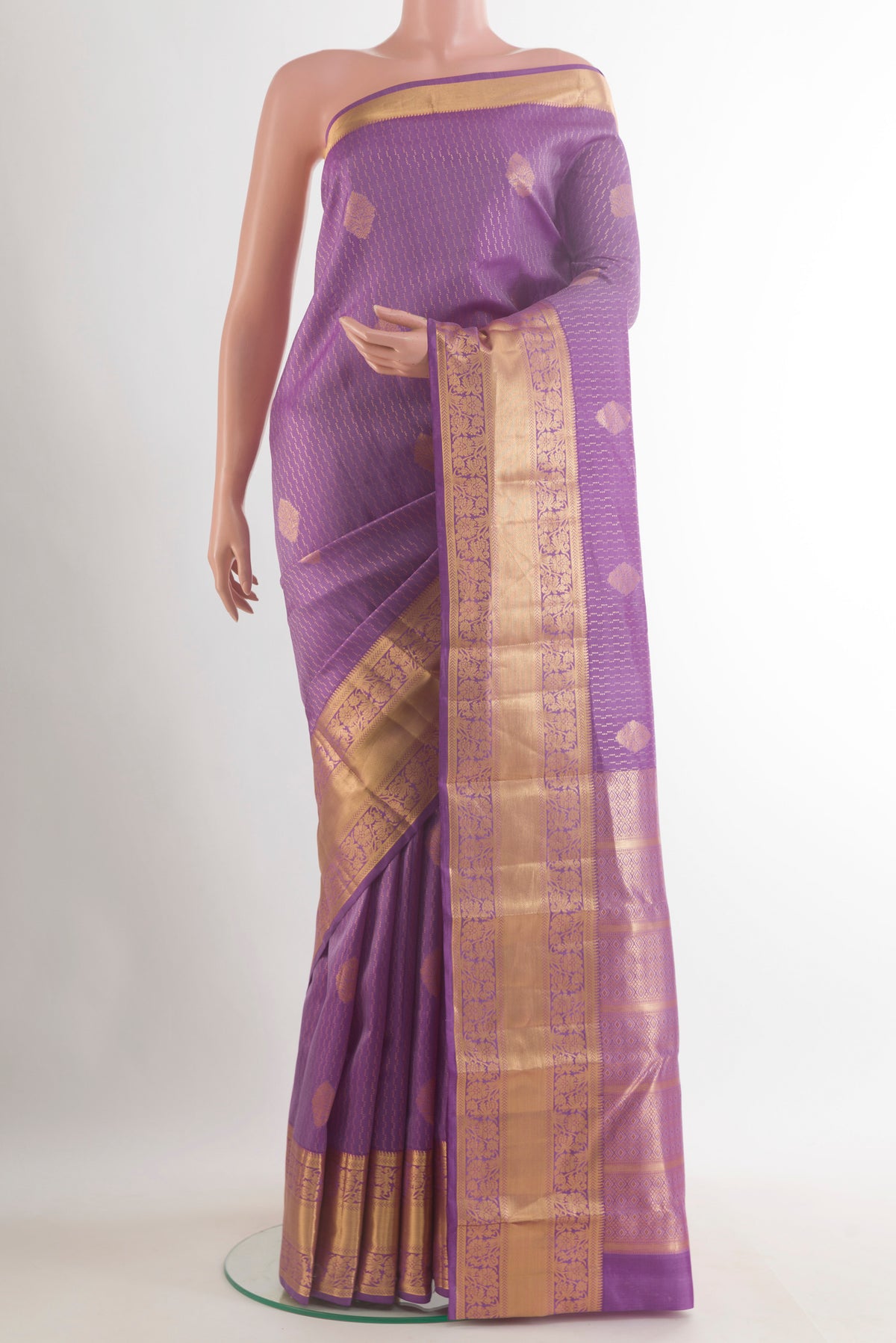 Pure Silk Lavender Kanchipuram Saree with Zari Butta on the body and Zari Border.  displayed on a mannequin