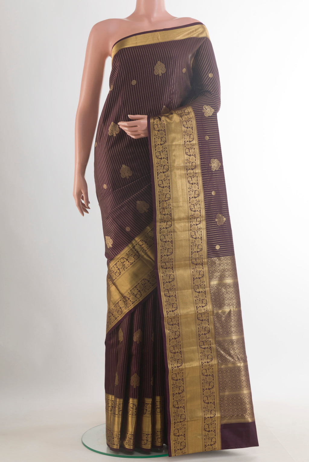 Pure Silk Purple Kanchipuram Saree with Stripes on the body and Zari Border.  displayed on a mannequin