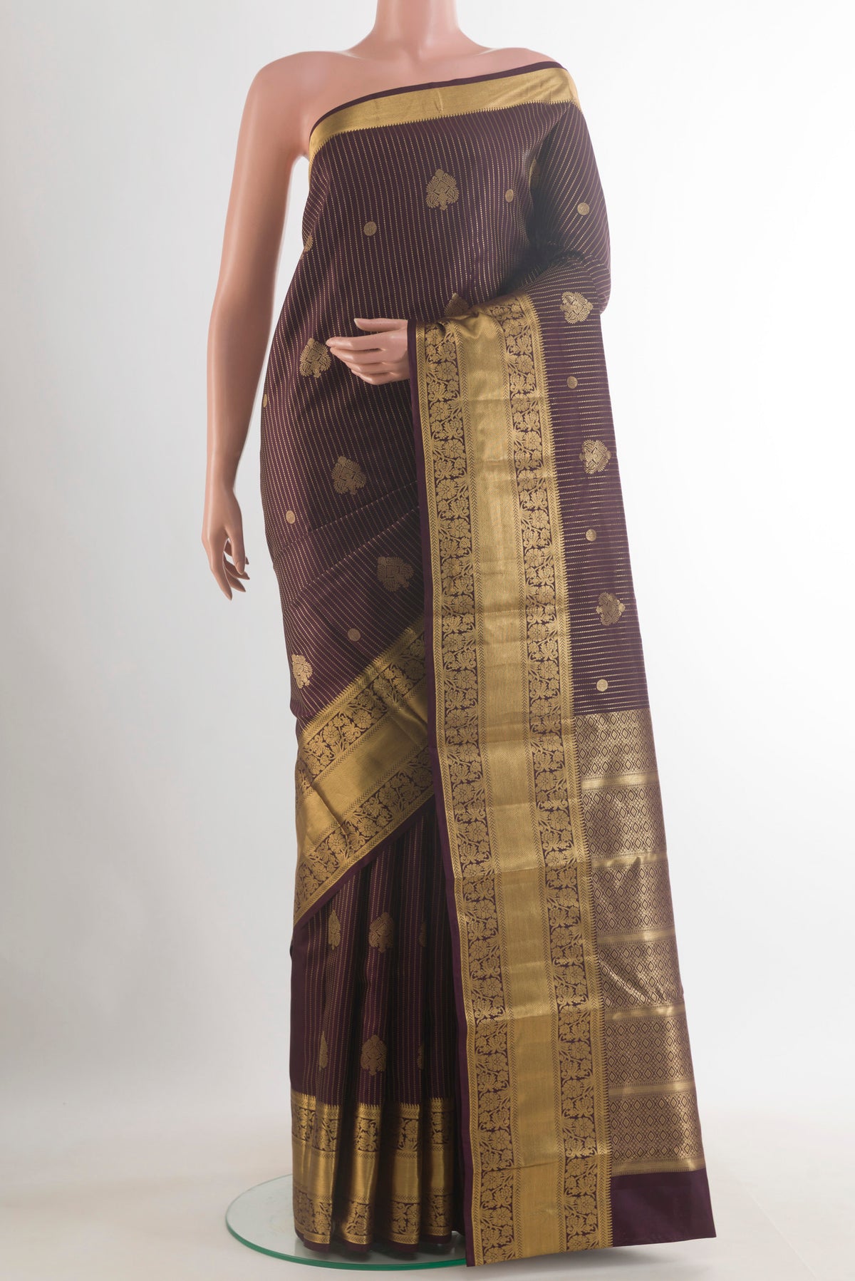 Pure Silk Purple Kanchipuram Saree with Stripes on the body and Zari Border.  displayed on a mannequin