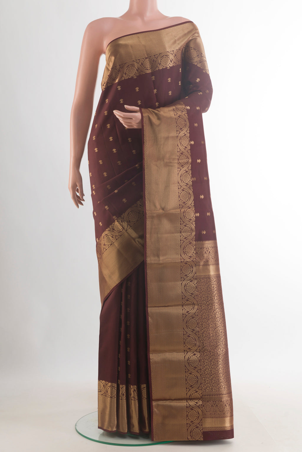 Pure Silk Coffee Brown Kanchipuram Saree with Zari Butta on the body and Zari Border.  displayed on a mannequin