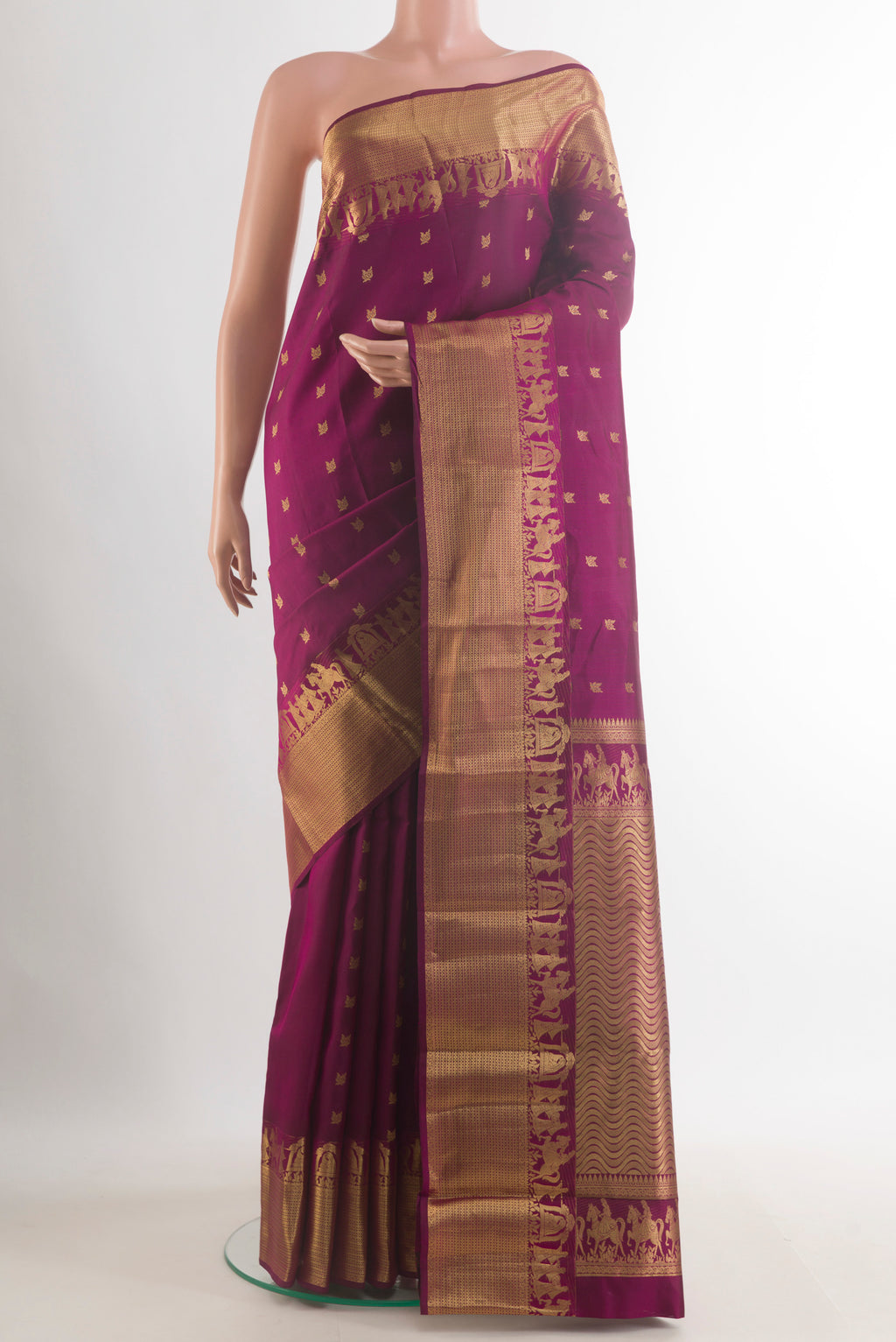 Pure Silk Burgundy Kanchipuram Saree with Zari Butta on the body and Zari Border.  displayed on a mannequin