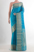 Pure Silk Blue Kanchipuram Saree with Zari Butta on the body and Zari Border.  displayed on a mannequin