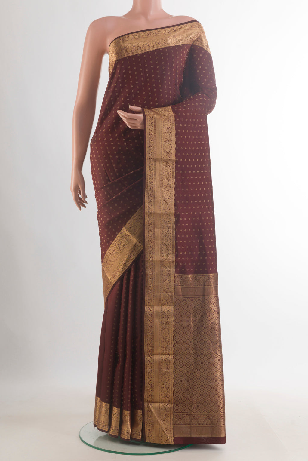 Pure Silk Brown Kanchipuram Saree with Zari Butta on the body and Zari Border.  displayed on a mannequin