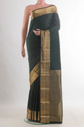 Pure Silk Bottle Green Kanchipuram Saree with Zari Butta on the body and Zari Border.  displayed on a mannequin