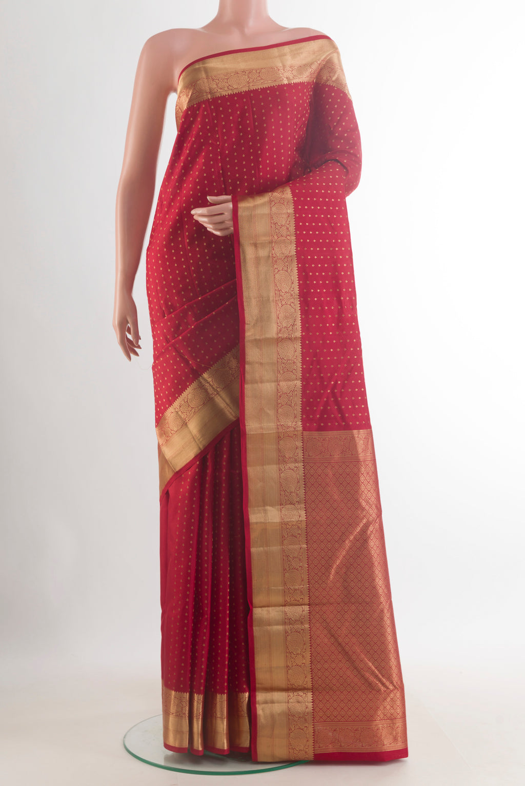 Pure Silk Red Kanchipuram Saree with Zari Butta on the body and Zari Border.  displayed on a mannequin