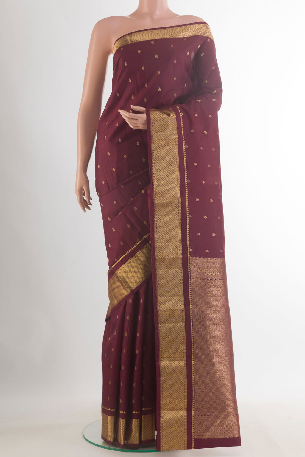 Pure Silk Coffee Brown Kanchipuram Saree with Zari Butta on the body and Zari Border.  displayed on a mannequin