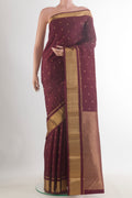 Pure Silk Coffee Brown Kanchipuram Saree with Zari Butta on the body and Zari Border.  displayed on a mannequin