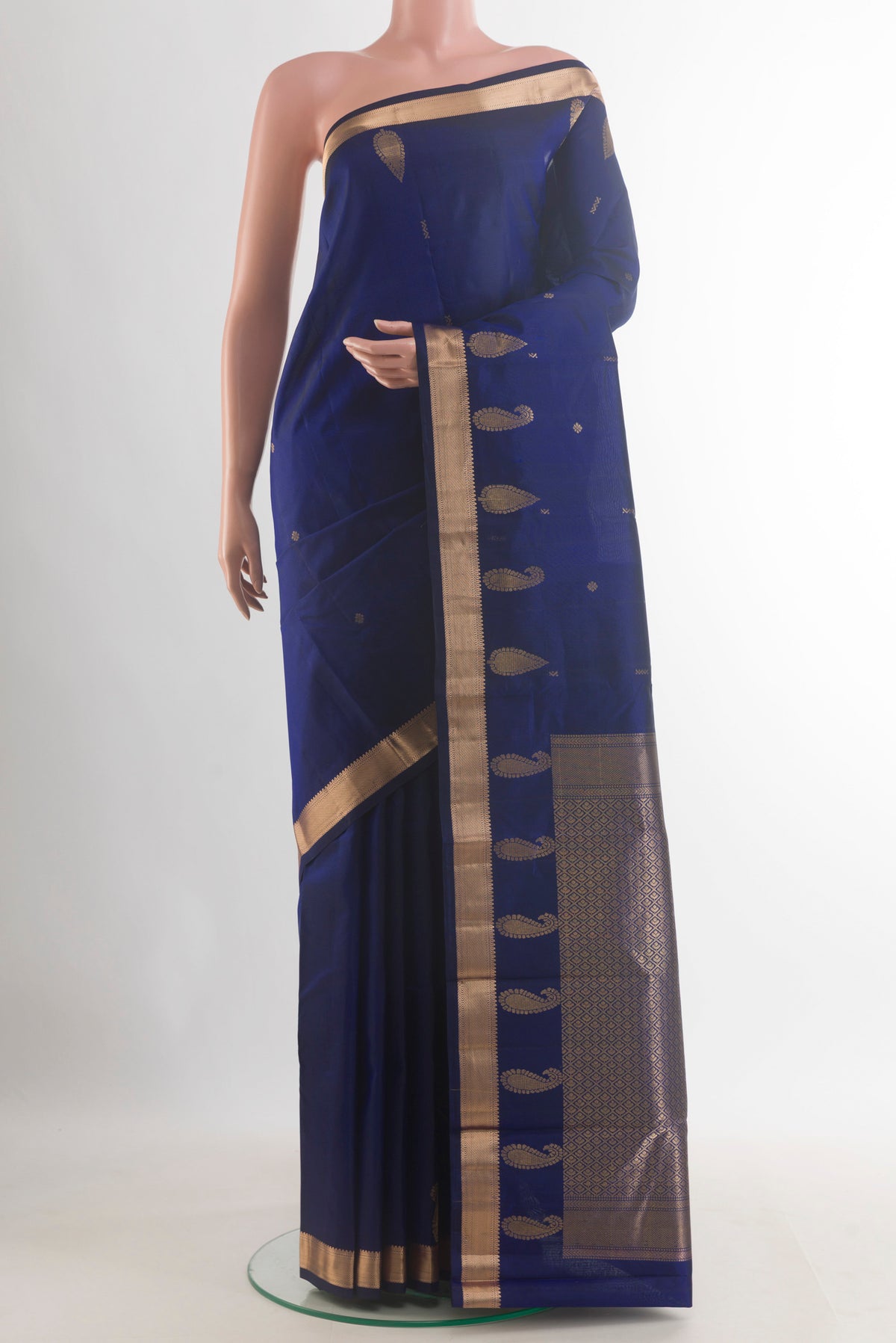 Pure Silk Dark Blue Kanjivaram Saree with Zari Butta on the body and Zari Border.  displayed on a mannequin