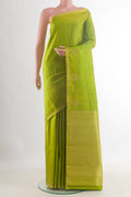Pure Silk Green Kanchipuram Saree with Zari Butta on the body and Zari Border.  displayed on a mannequin