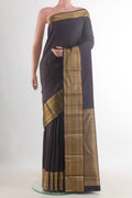 Pure Silk Dark Blue Kanjivaram Saree with Zari Butta on the body and Zari Border.  displayed on a mannequin