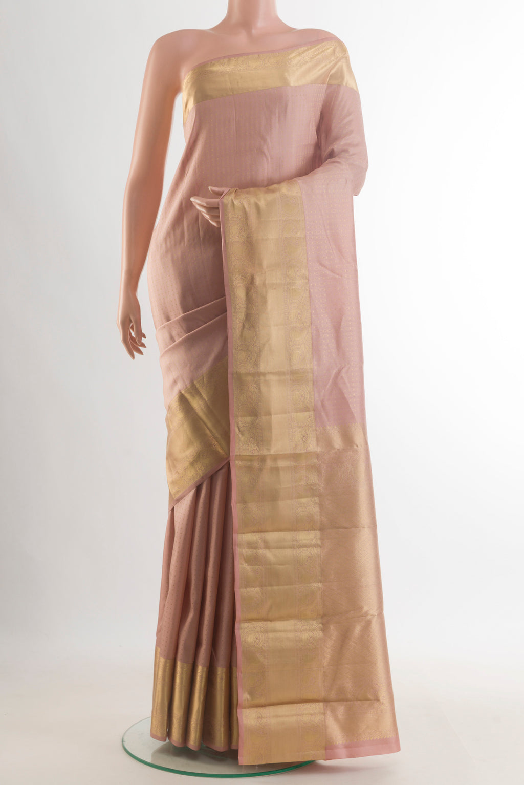 Pure Silk Sandal Kanjivaram Saree with Zari Butta on the body and Zari Border.  displayed on a mannequin