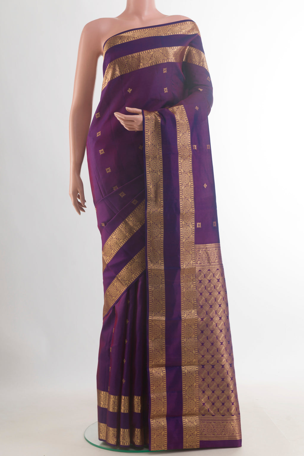 Pure Silk Purple Kanchipuram Saree with Zari Butta on the body and Zari Border.  displayed on a mannequin