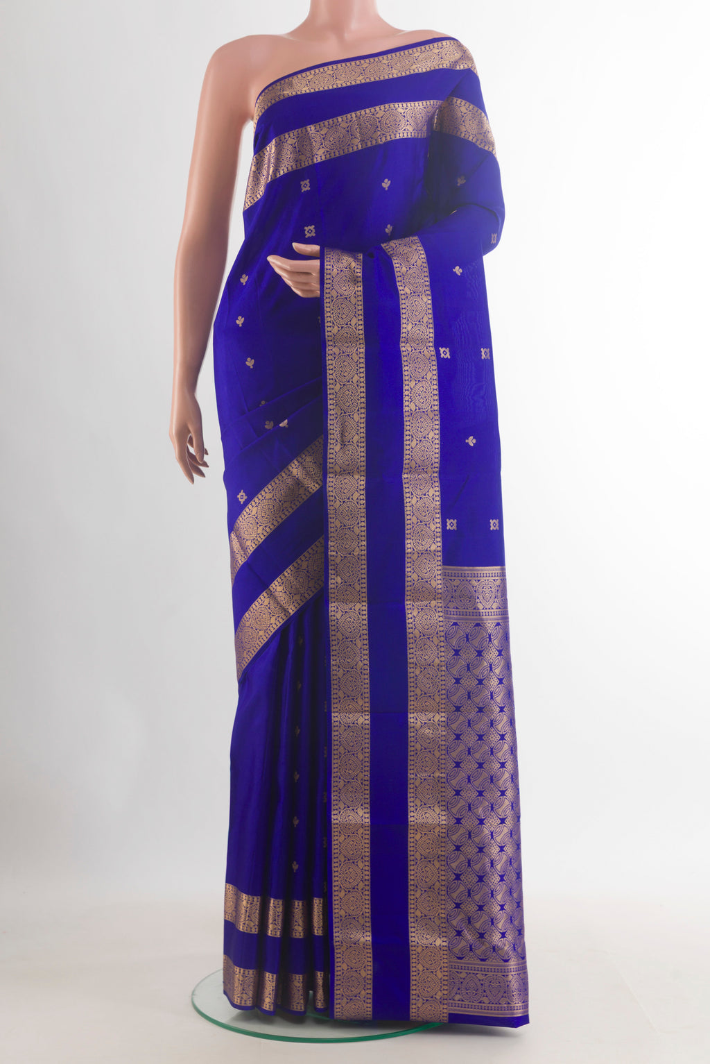 Pure Silk Royal Blue Kanchipuram Saree with Zari Butta on the body and Zari Border.  displayed on a mannequin
