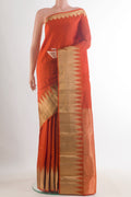 Pure Silk Orange Kanchipuram Saree with Plain Body and Zari Border.  displayed on a mannequin