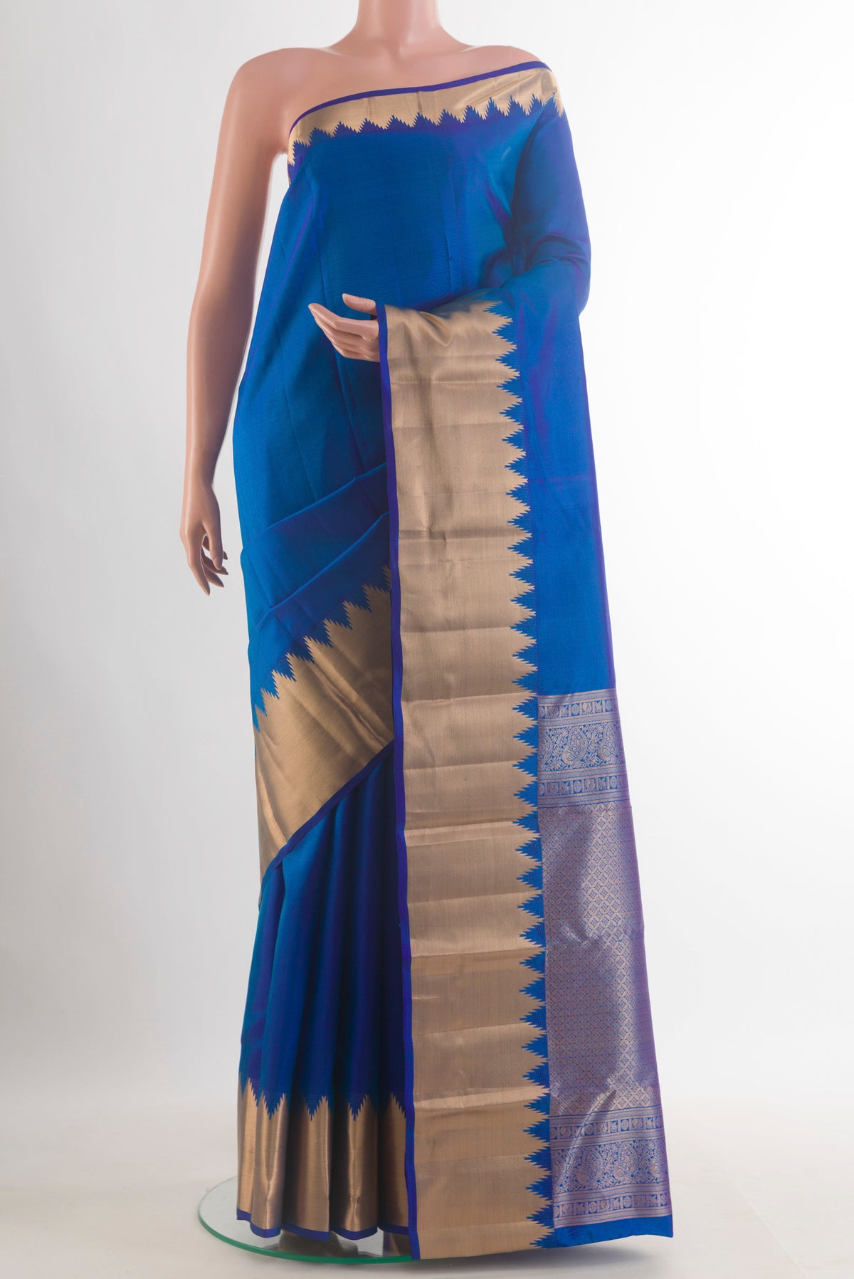 Pure Silk Royal Blue Kanchipuram Saree with Plain Body and Zari Border.  displayed on a mannequin